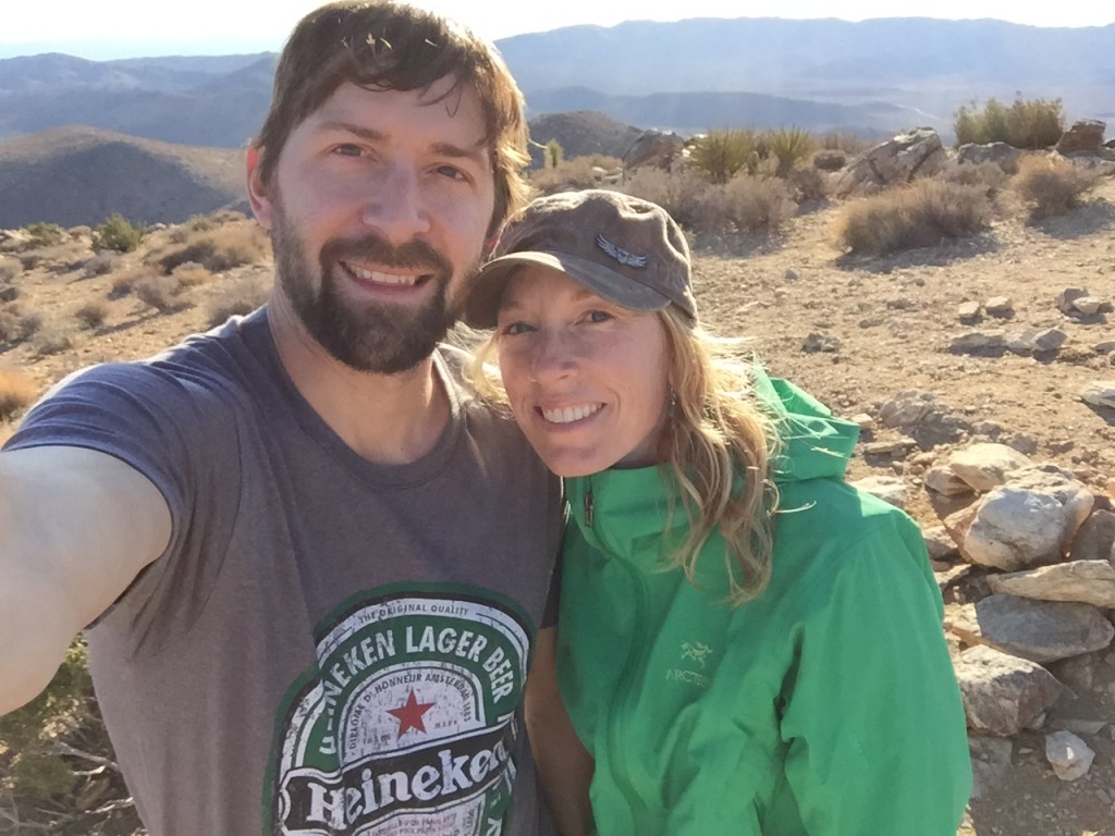 A selfie of Jeff and Andrea on top of a mountain in Joshua Tree National Park