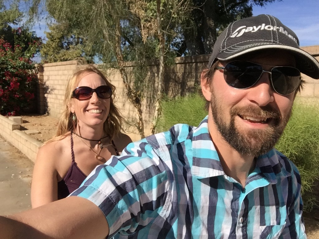 A closeup of Andrea and Jeff riding a tandem bike.