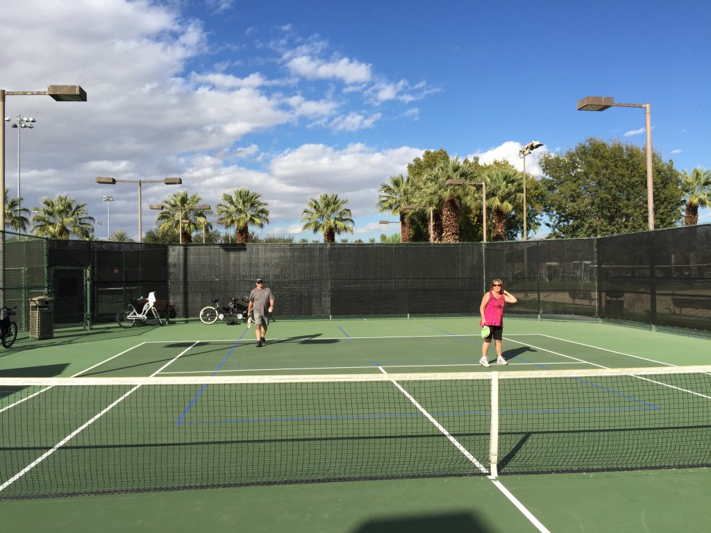 Playing pickleball on a tennis court in Palm Springs, California.