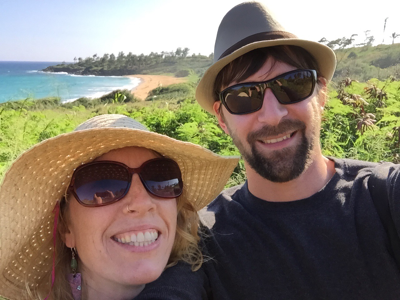 Selfie of Andrea and Jeff in front of a beach