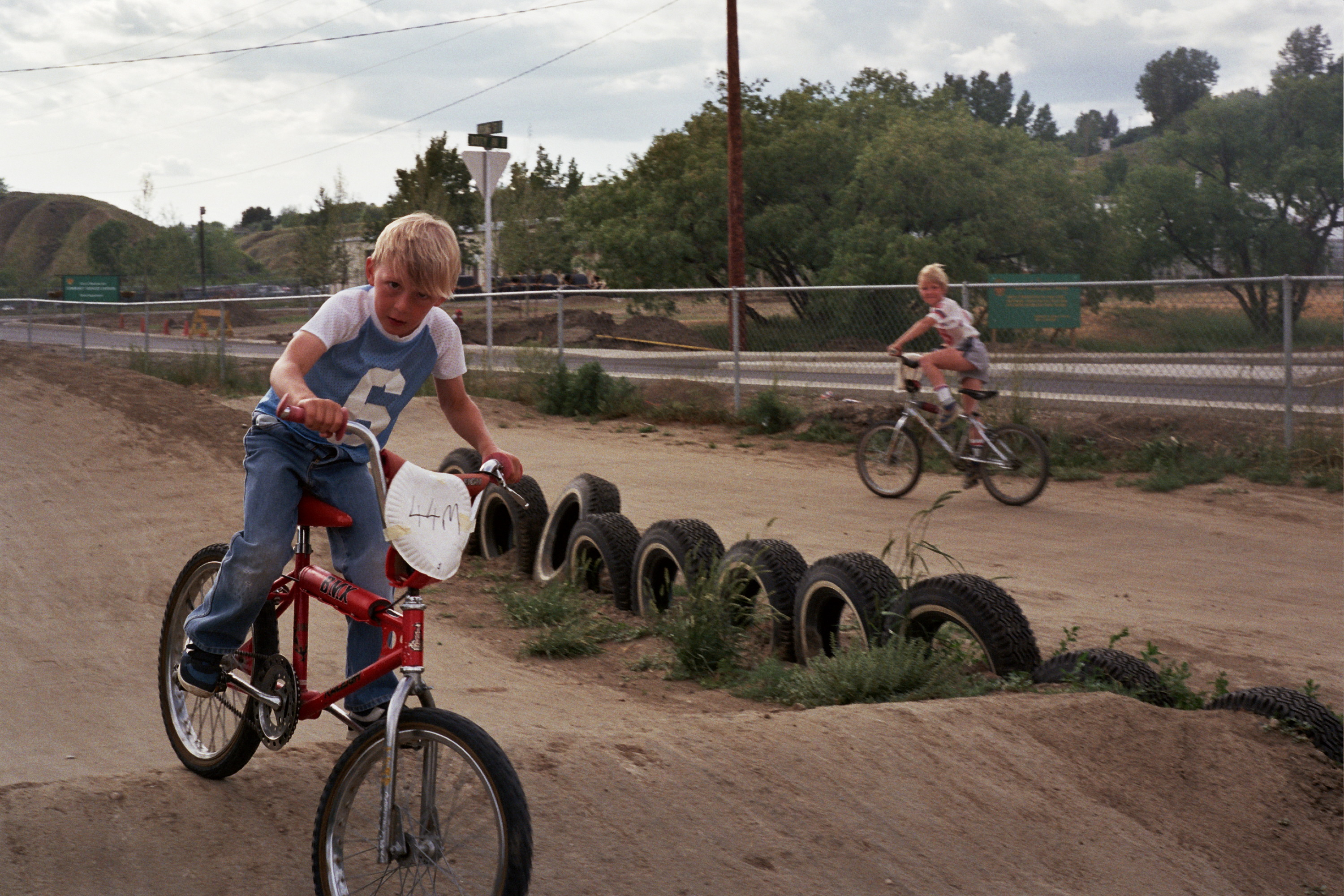 Jeff Milner riding BMX, Chris MacDonald in the background