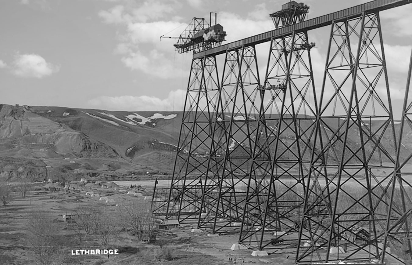 View showing the one stage of construction on High Level Bridge. The traveller is visible. Area of the river valley also visible.